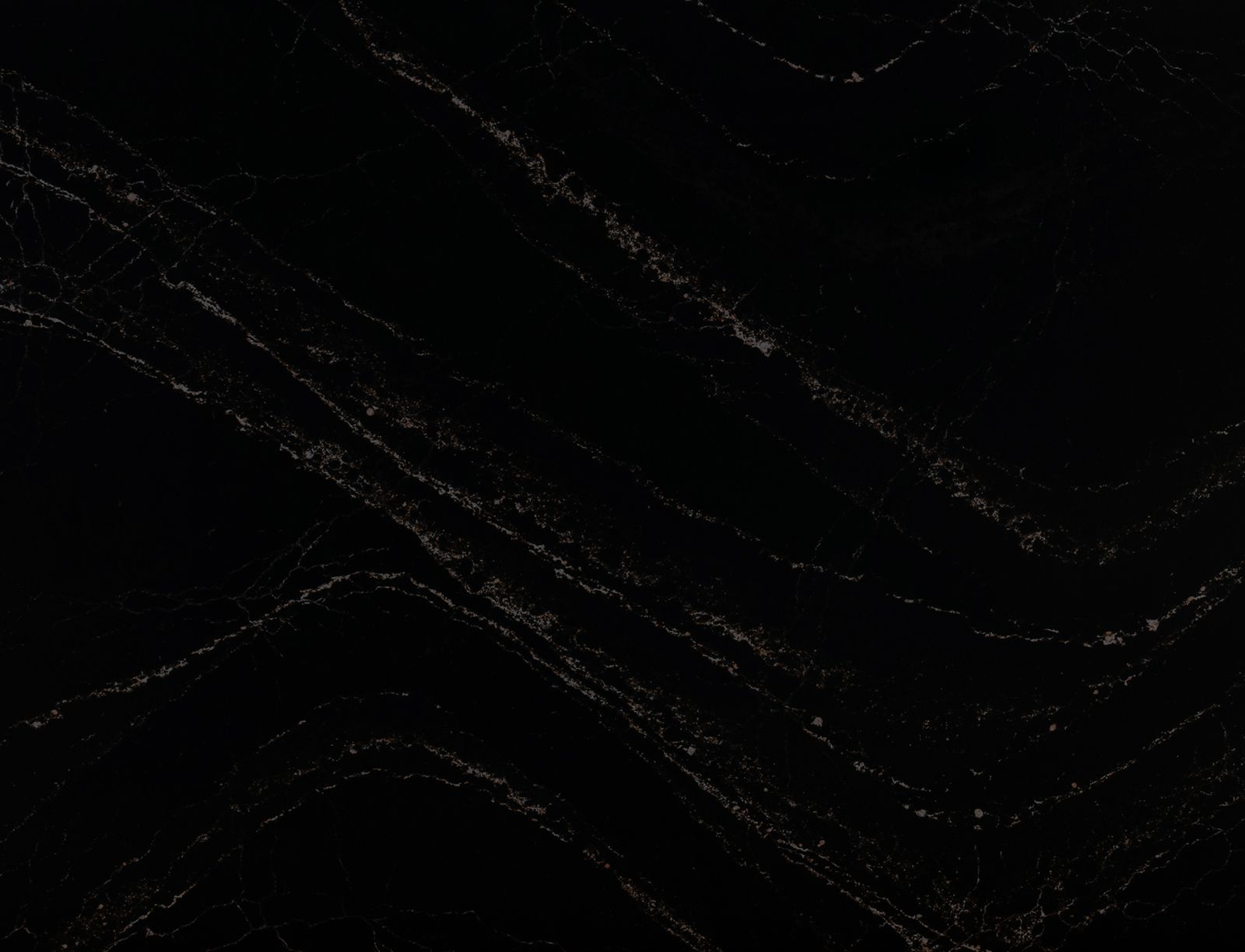 Woman with blonde curls posing gracefully indoors.