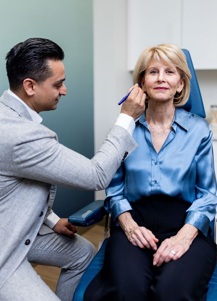 Medical professional consulting with patient in clinic.
