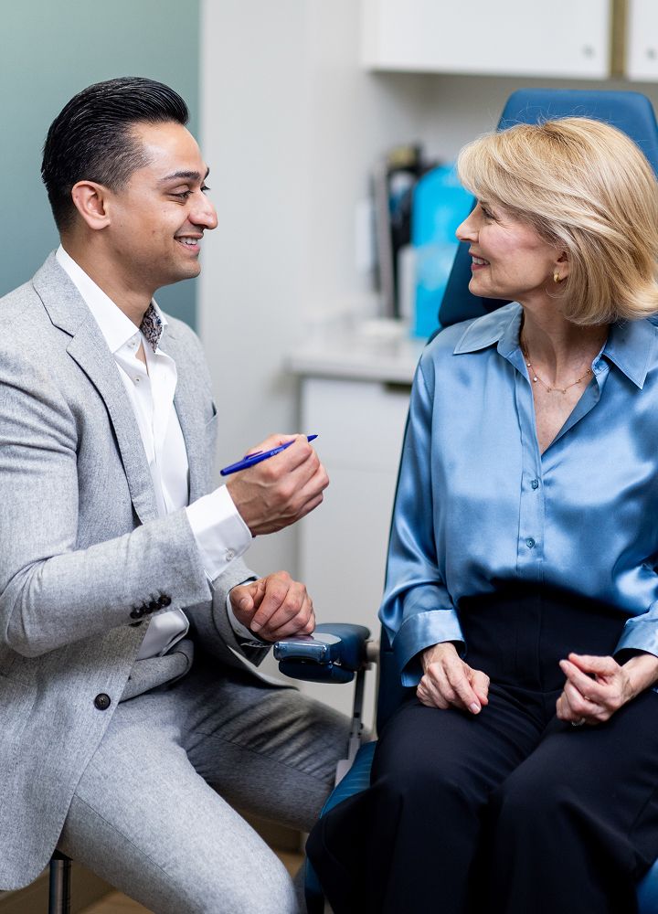 Doctor consulting with patient in medical office.