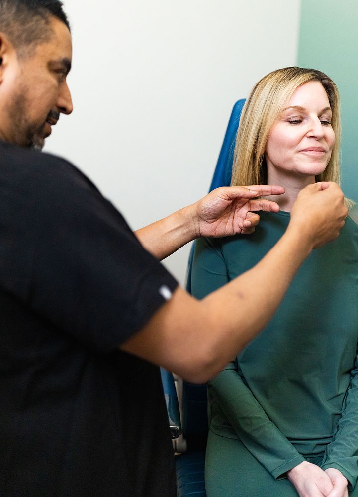 Cosmetic procedure consultation between practitioner and patient.