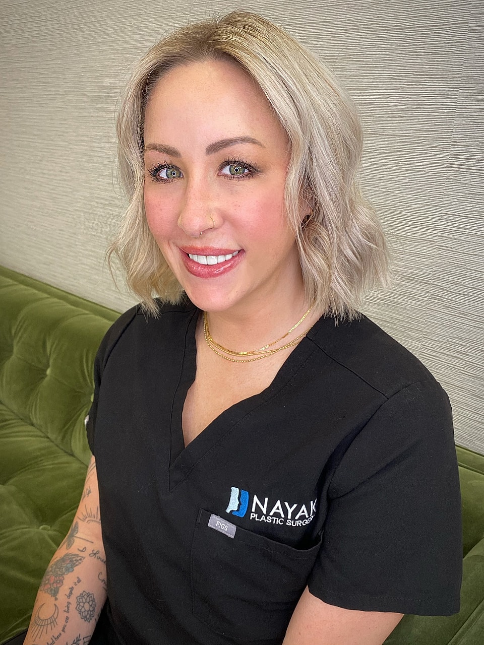 Smiling professional in a medical setting.