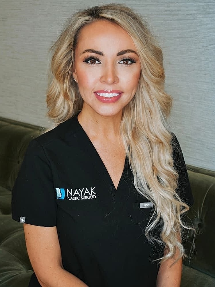 Medical professional in plastic surgery uniform.