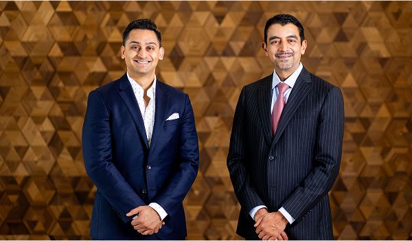 St. Louis facial plastic surgeon Dr. Nayak and Dr. Kachare posing together.