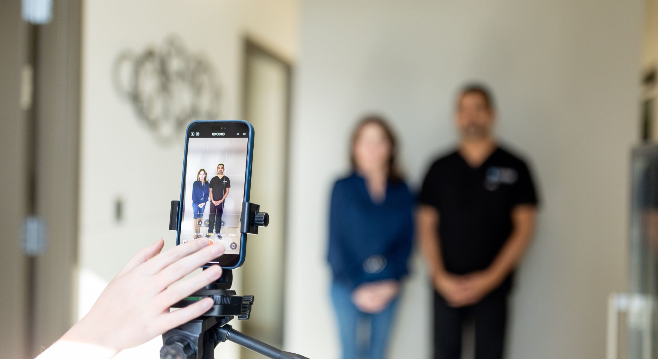 Someone taking a photo of two people.