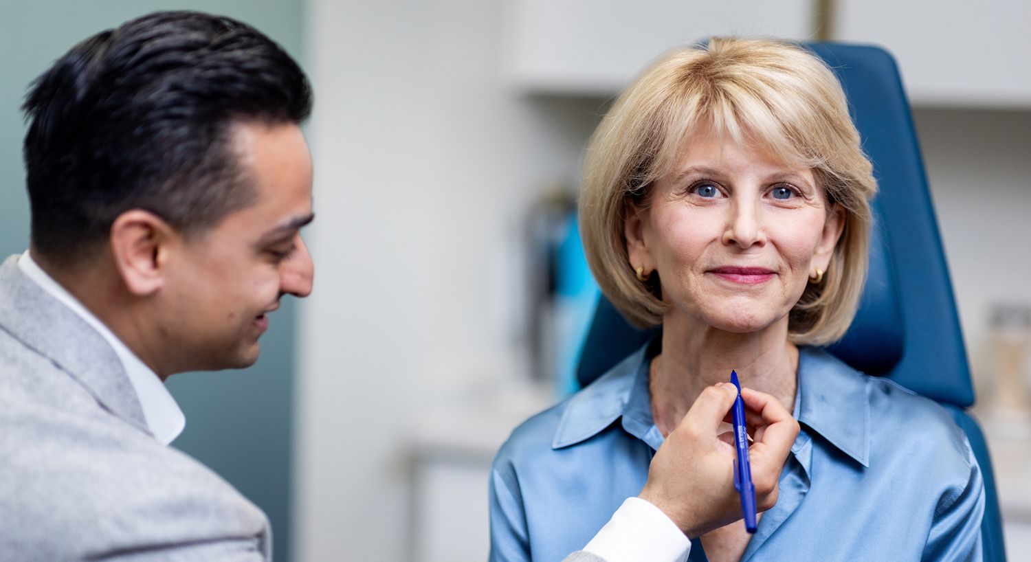 Consultation for facial treatment in clinic setting.