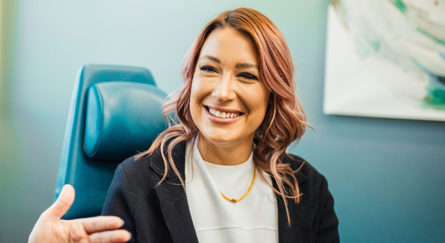 Smiling woman in a professional setting.