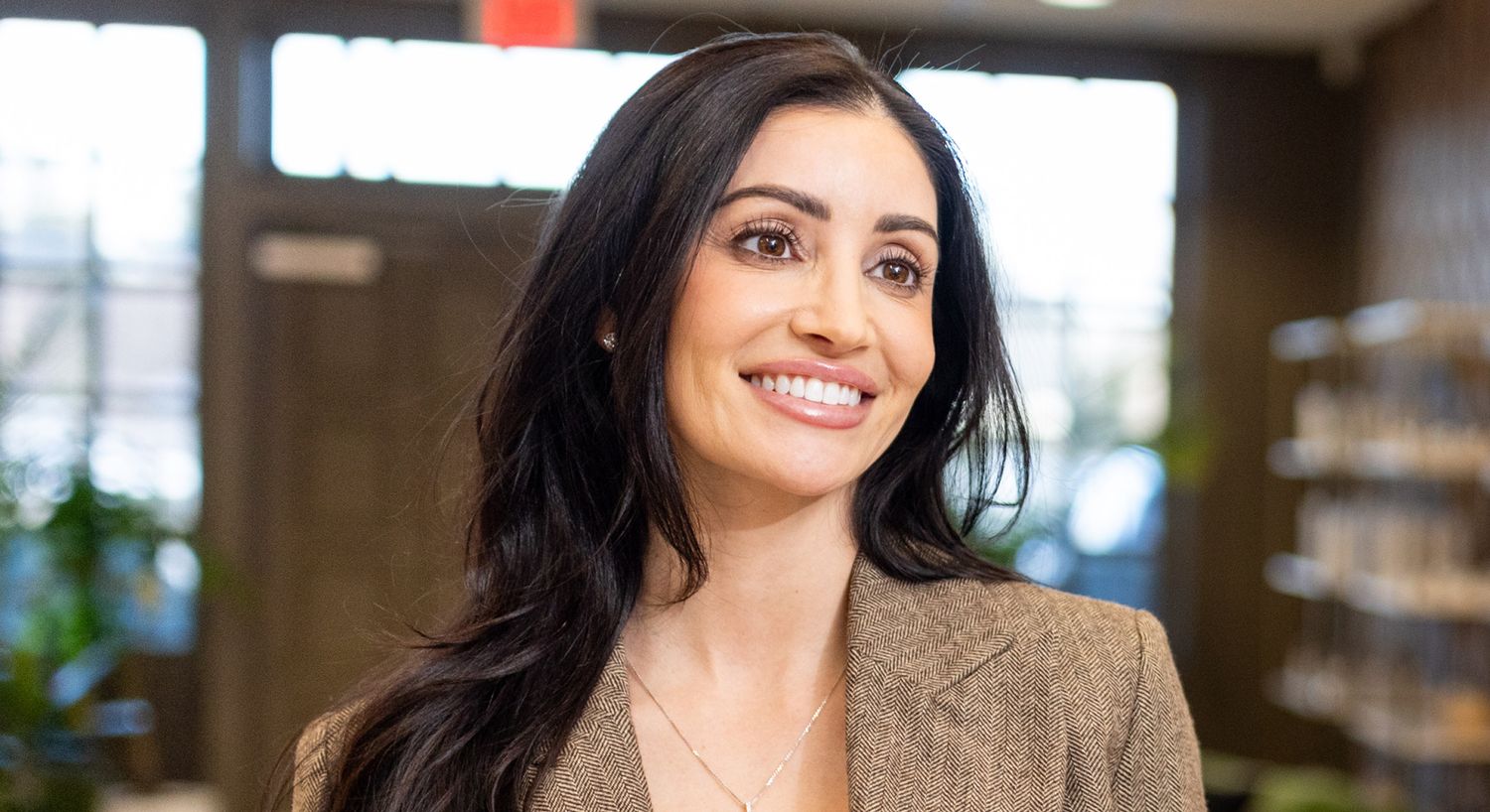 Smiling woman in a professional setting.
